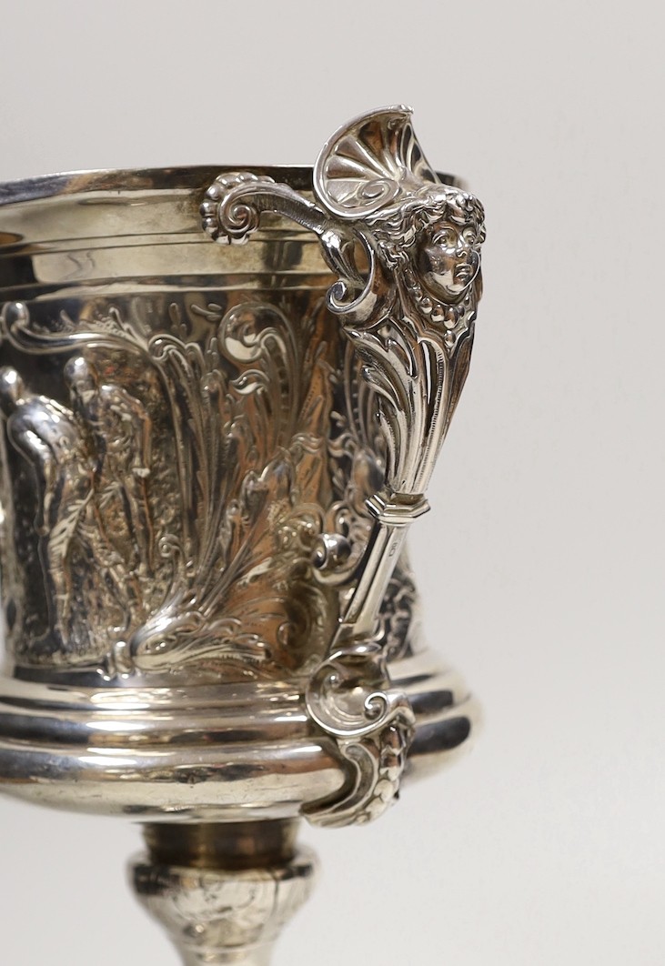 FOOTBALL INTEREST- A late Victorian silver two handled presentation trophy cup, embossed with footballers and inscribed ' Vernon Wentworth Challenge Cup, presented top The Brighton Football Association by Bruce c. Vernon